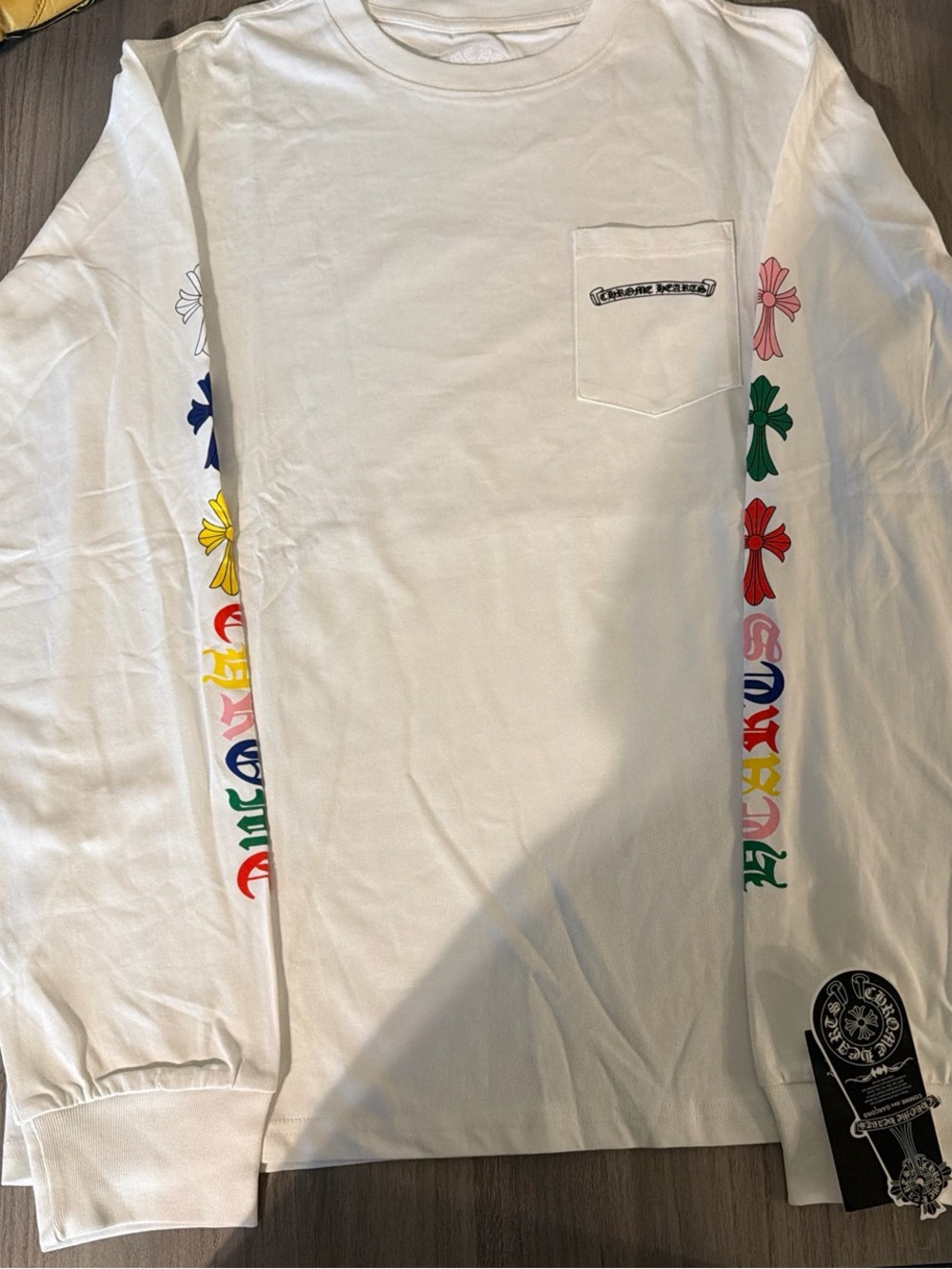 White Long-Sleeve Pocket Tee with Multicolor Cross Sleeve Graphics